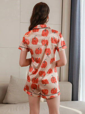 satijnen shortama dames met oranje bloemenprint