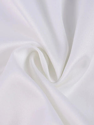 Wit satijnen halter jurkje met bloemen split