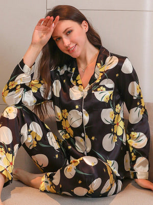 Zwarte lange satijnen pyjama dames met bloemenprint
